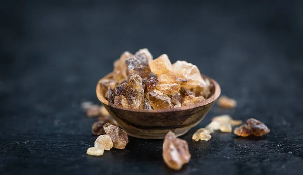 Slate slab with brown Rock Candies — Stock Photo, Image