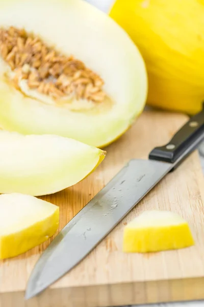Honeydew Melon on an old wooden table — Stock Photo, Image