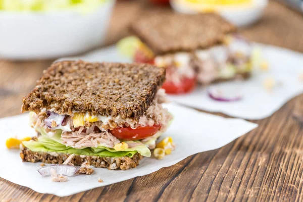 Wooden table with Tuna sandwiches — Stock Photo, Image