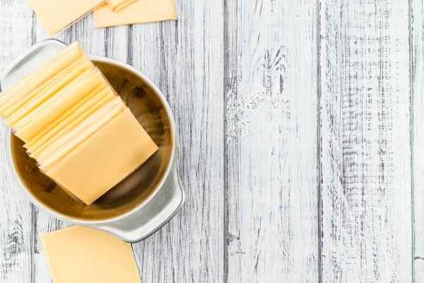 Sliced Cheese on a vintage background — Stock Photo, Image