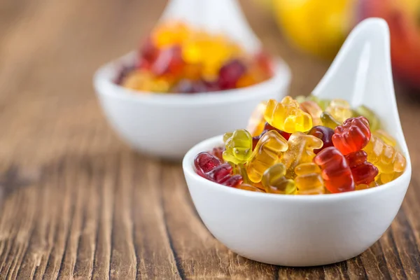 Wooden table with Gummy Bears Stock Image