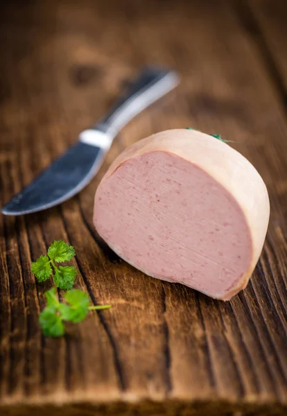 German Leberwurst on an old wooden table — Stock Photo, Image