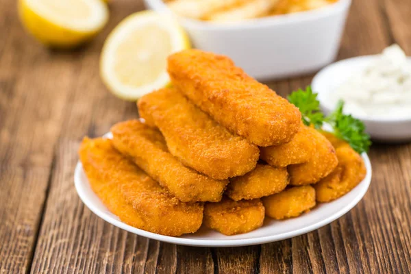 Fisch Sticks on an old wooden table — Stock Photo, Image