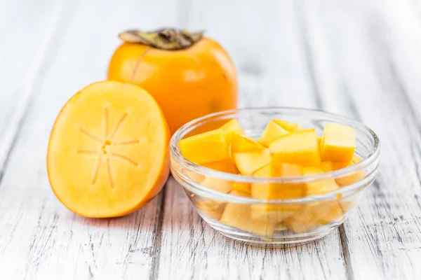 Cutted persimmon in bowl — Stock Photo, Image