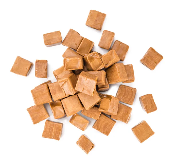 Porción de caramelo sobre blanco —  Fotos de Stock