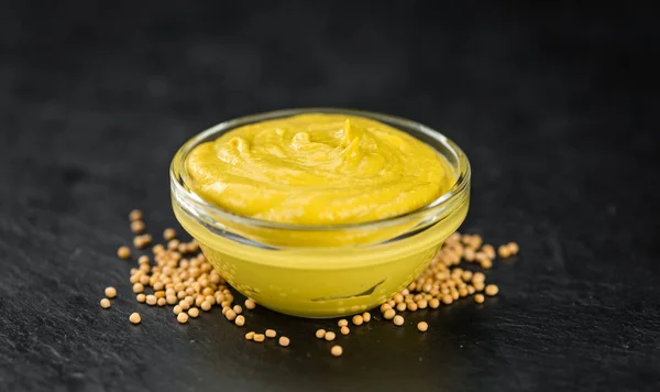 Mustard in glass plate — Stock Photo, Image