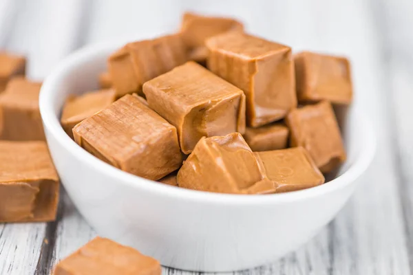 Caramel pieces on table — Stock Photo, Image