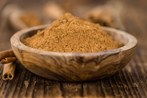 Cinnamon Powder in wooden bowl — Stock Photo, Image