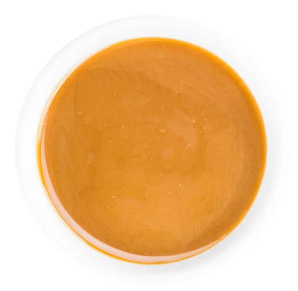 Карамельный соус на столе — стоковое фото