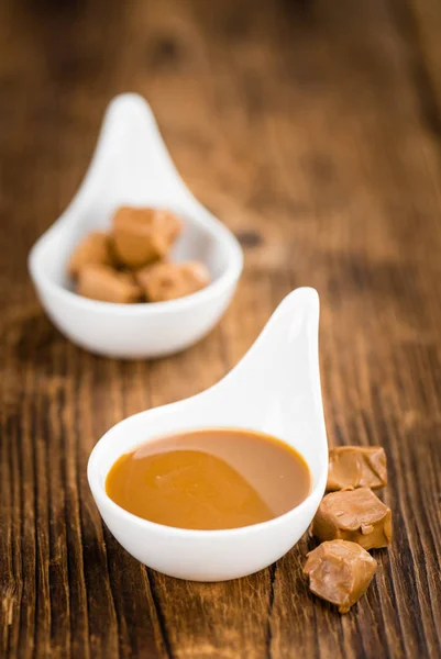 Caramel Sauce on table — Stock Photo, Image