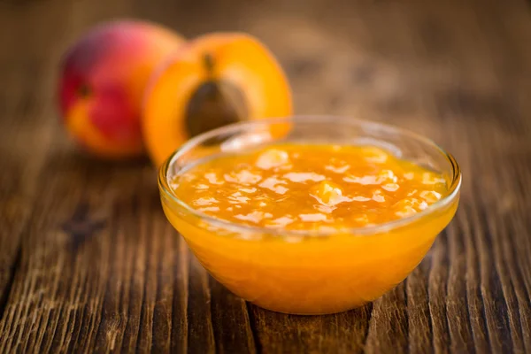 Apricot Jam on wooden background — Stock Photo, Image