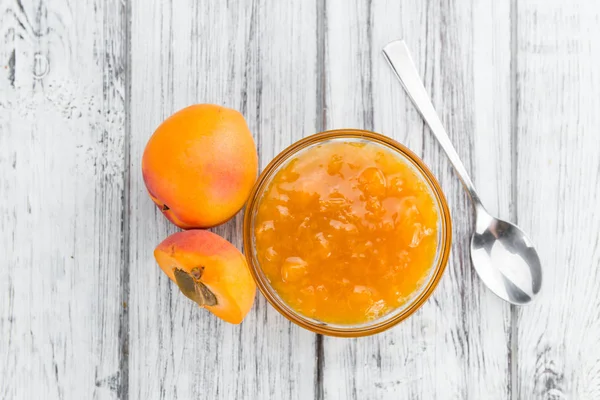 Apricot Jam on wooden background — Stock Photo, Image