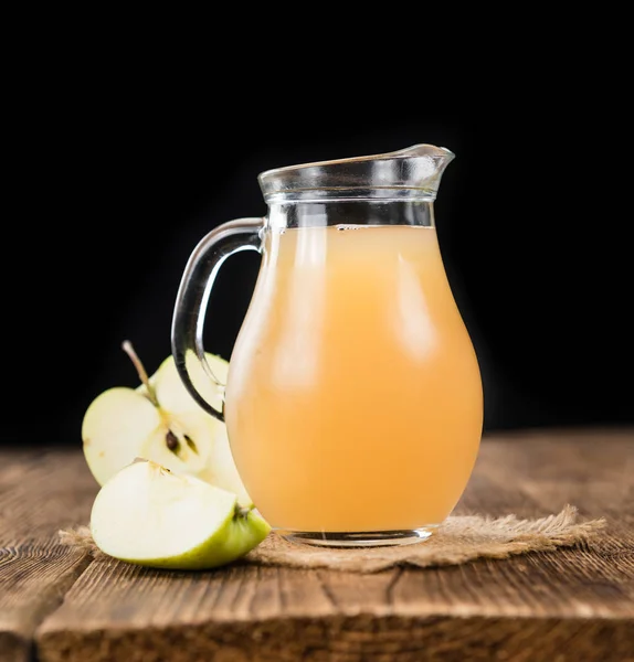 Juice on an old wooden table — Stock Photo, Image