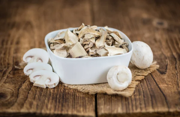 Wooden table with Dried white Mushrooms — Stock Photo, Image