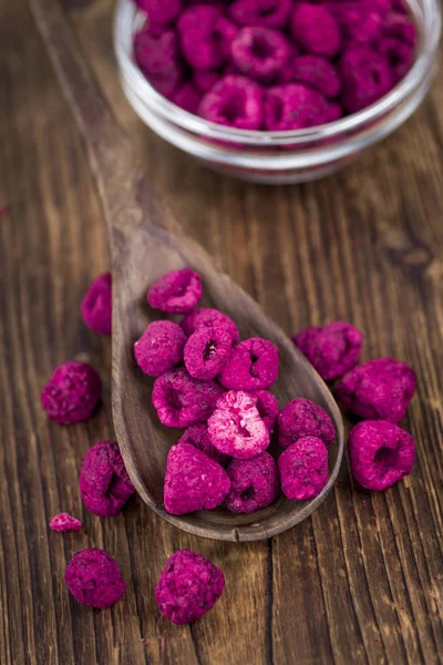 Wooden table with Dried Raspberries — Stock Photo, Image