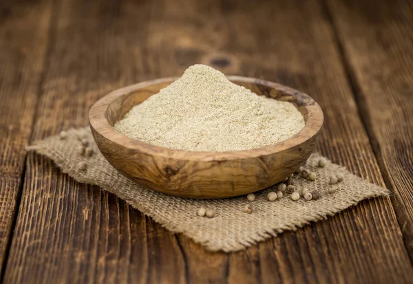 Portion of White Pepper on wooden background, selective focus — Stock Photo, Image