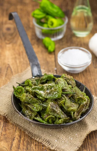 Fresh made Pimientos de Padron on a rustic background — Stock Photo, Image