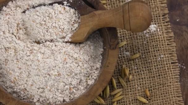 Some fresh Oat Flour on wooden background (selective focus; clos — Stock Video