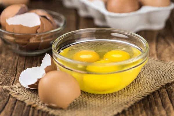 Raw Eggs on an old wooden table (selective focus) — Stock Photo, Image