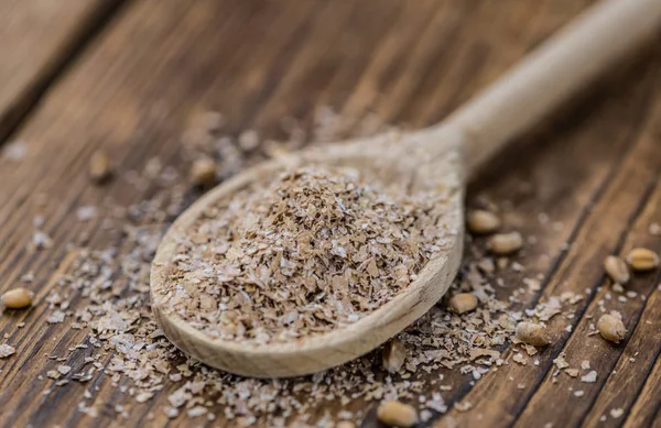 Vintage wooden table with Wheat Bran (selective focus; close-up — Stock Photo, Image