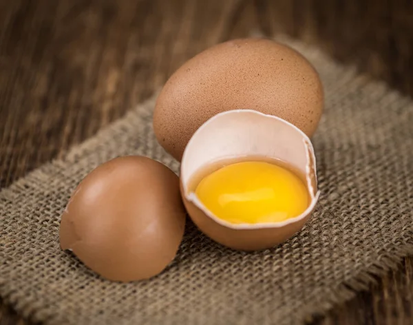 Raw Eggs on an old wooden table (selective focus) — Stock Photo, Image