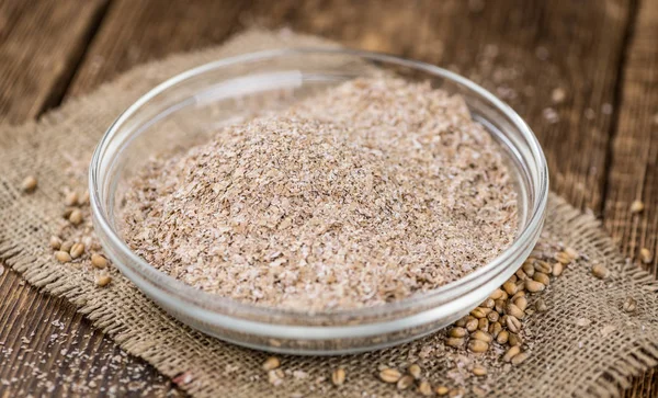 Portion of healthy Wheat Bran (selective focus; close-up shot) — Stock Photo, Image