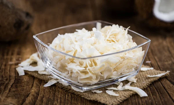 Gesunde Kokosflocken Auf Einem Holztisch Als Detailaufnahme Selektiver Fokus — Stockfoto