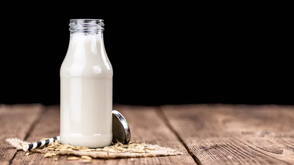 Tavolo Legno Con Latte Avena Primo Piano Dettagliato Messa Fuoco — Foto Stock