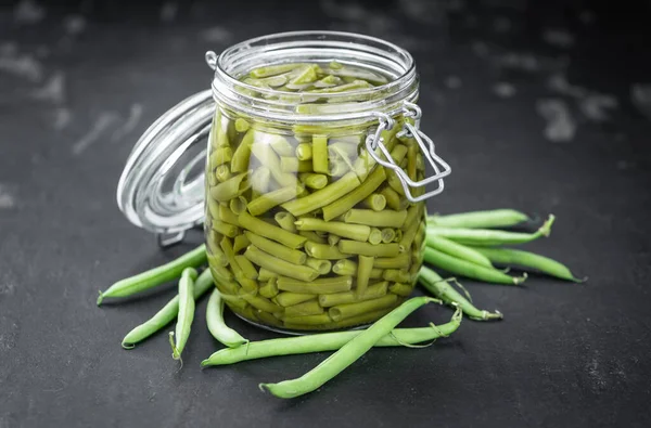 Portion of canned Green Beans (close-up shot; selective focus)