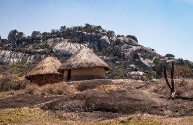 African village at the ancient Great Zimbabwe ruins next to Lake Mutirikwe clipart