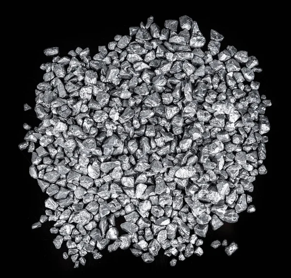 Heap of silver nuggets isolated on black background (close up)