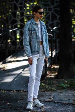 MILAN, Italy- September 21 2019: Model Lea Julian on the street during the Milan Fashion Week. clipart