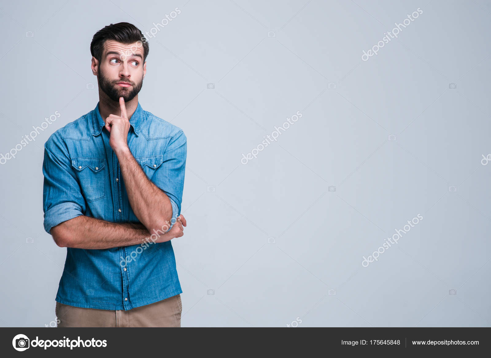 Hmmm What Handsome Young Man Looking Confused While Standing Againstwhite  Stock Photo by ©masha10-09@ukr.net 175645848