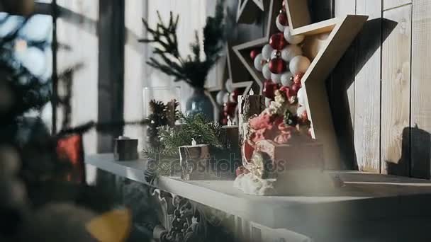 An original decor in the form of a wooden star hanging on a wooden wall of a cozy room near the Christmas tree — Stock Footage An original decor in the form of a wooden star hanging on a wooden wall of a cozy room near the Christmas tree Royalty Free Stock Video