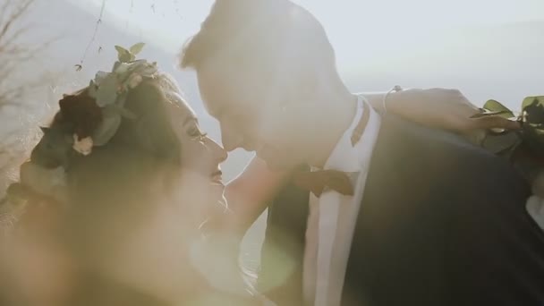 Close up. Bride and groom in love walking together in sunny mountain. Wedding day — Stock Video