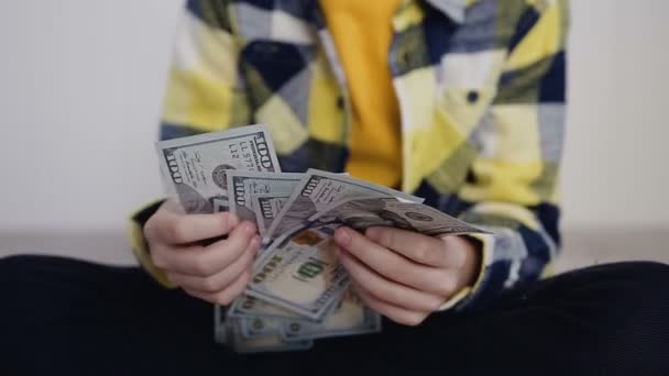 View of a guy Counting Many American 100 bills, enough money. High Angle Male Hands Count Hundred Dollar Bills. Counting money dollar bills. White background, indoors — Stock Video