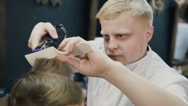 Professional Blonde Hairdresser Doing A New Haircut On Wet Hair