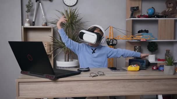 Cool joyful modern 7-aged boy dancing at home using virtual reality headset — 비디오