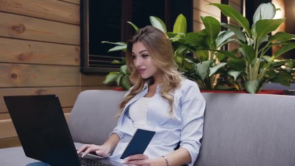 Pretty satisfied 30-aged blondie carefully looking at the computer and waiting for results,then she is happy and clapping her hands — Stock Video