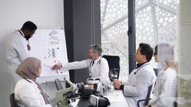 High-skilled mixed race medical people which discussing with one another the actual medicine problems