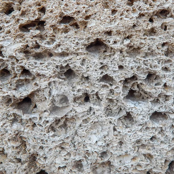 Sandstensstruktur. Naturligt formad sandsten skapar en unik struktur och bakgrund. — Stockfoto