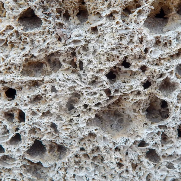 Sandstensstruktur. Naturligt formad sandsten skapar en unik struktur och bakgrund. — Stockfoto