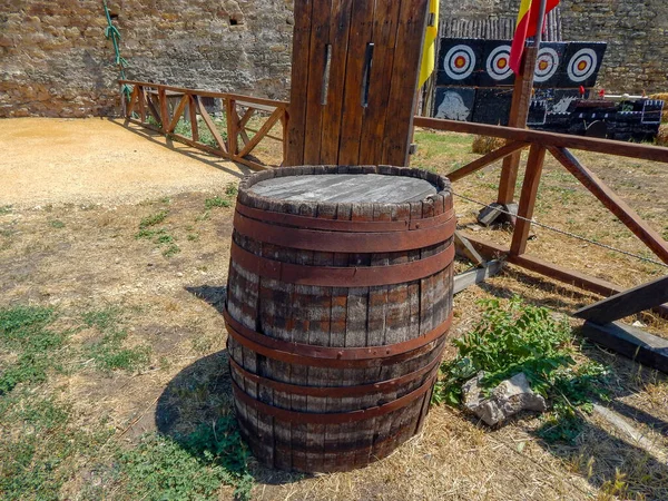 wooden barrel with iron rings in the fortress