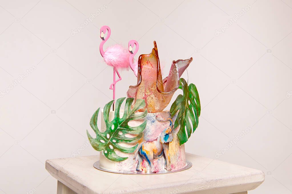 Delicious birthday cake topper with decoration flamingo leaves of sugar paper, cake for birthday and holiday.