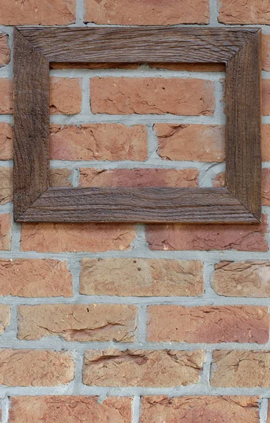 Old frame on brick wall — Stock Photo, Image