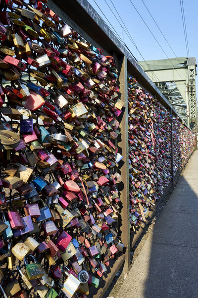 Hohenzollern Bridge in Cologne, Germany is weighed down with amazing love locks