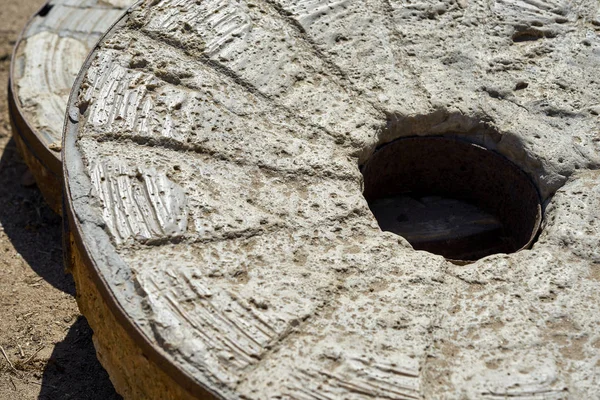 Antique millstone used for grinding corn in California \ Mexico Royalty Free Stock Images