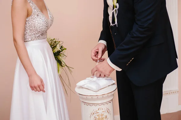 Marry me. Groom put a ring on finger of his lovely wife. Wedding couple together