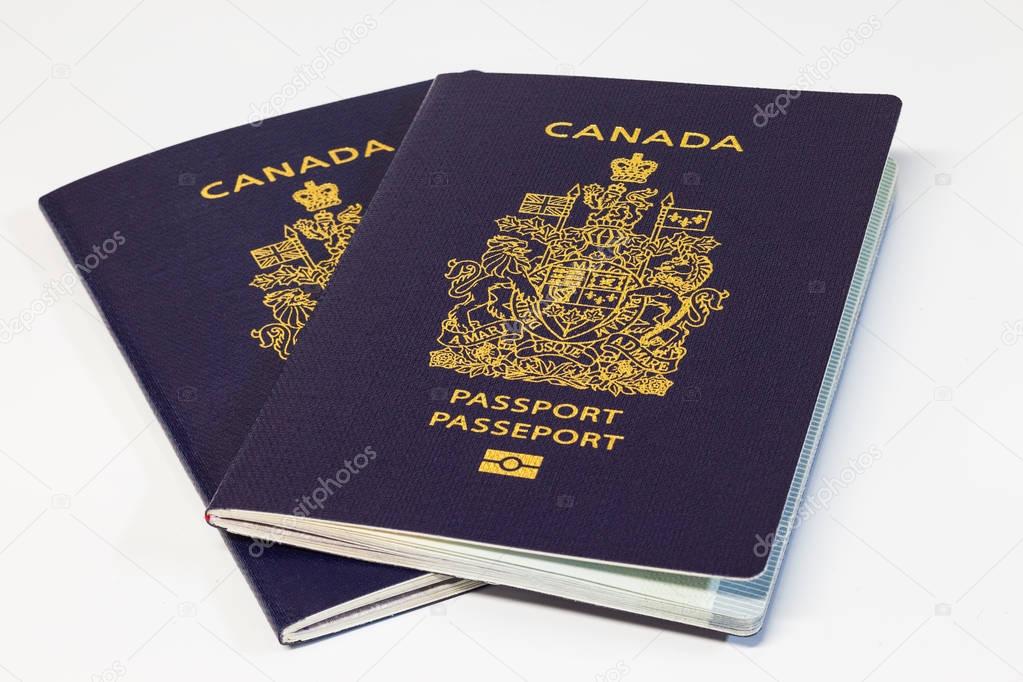 Two Canadian passports on white background