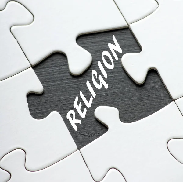 The word Religion revealed by a missing jigsaw puzzle piece — Stock Photo, Image